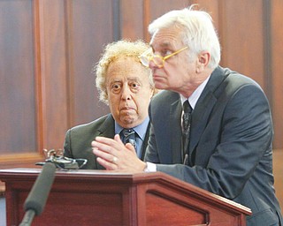 Mark Belinky, left, a former Mahoning County Probate Court judge, listens as J. Gerald Ingram, his attorney, makes a point about putting his client on probation and not in prison.