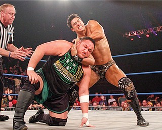 TNA wrestler Ethan Carter III, right, grapples with Samoa Joe.

