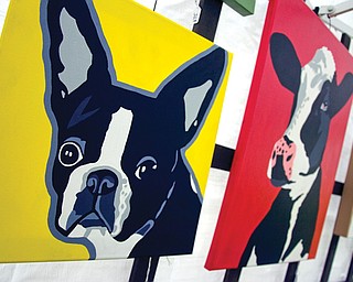 A painting of a Boston Terrier is displayed Saturday by artist Jessica Blair, from Girard, during last years’ Youngstown State University Festival of the Arts.
