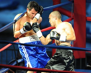 PITTSBURGH, PENNSYLVANIA - JULY 11, 2014: Jake Giuriceo throws a uppercut to the head of Travis Hartman during a welterweight bout Friday night at Rivers Casino. Giuriceo would win via 4th round TKO. (Photo by David Dermer/Youngstown Vindicator)