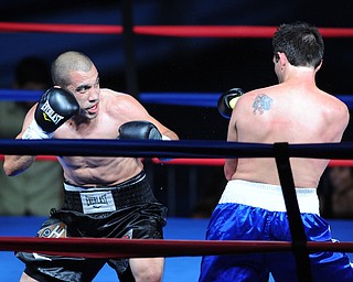PITTSBURGH, PENNSYLVANIA - JULY 11, 2014: Jake Giuriceo looks for a opening to throw a punch at Travis Hartman during a welterweight bout Friday night at Rivers Casino. Giuriceo would win via 4th round TKO. (Photo by David Dermer/Youngstown Vindicator)