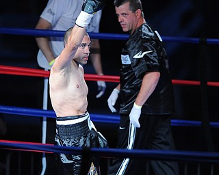 PITTSBURGH, PENNSYLVANIA - JULY 11, 2014: Jake Giuriceo celebrates in the center of the ring, while thanking his fans after a referee stoppage after a welterweight bout Friday night at Rivers Casino. Giuriceo would win via 4th round TKO. (Photo by David Dermer/Youngstown Vindicator) Trainer Keith Burnside pictured.