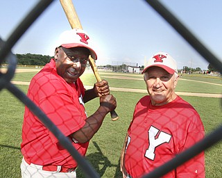 William D. Lewis The Vindicator .Senior Baseball players Charlie Harris, left, of Youngstown and Ron DiVincenzo of Boardman, both 74, play for Youngstown Classic in an over 58 baseball league.The are shown at Field of Dreams in Boardman.