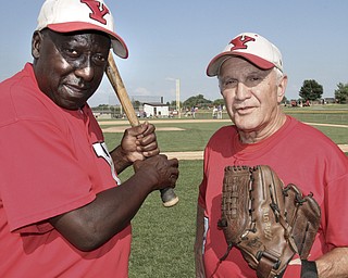 William D. Lewis The Vindicator .Senior Baseball players Charlie Harris, left, of Youngstown and Ron DiVincenzo of Boardman, both 74, play for Youngstown Classic in an over 58 baseball league.The are shown at Field of Dreams in Boardman.