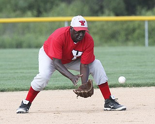 William D. Lewis The Vindicator .Senior Baseball player Charlie Harris,74, fields a ball while playing for Youngstown Classic in an over 58 baseball league at Field of Dreams in Boardman.