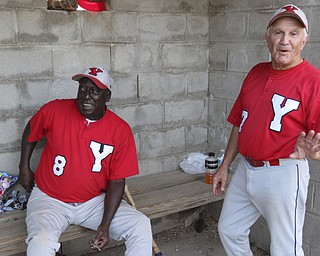 William D. Lewis The Vindicator .Senior Baseball player Charlie Harris, 74, of Youngstown , left, and Ron DiVencenzo, 74, of Boardman play for Youngstown Classic in an over 58 baseball league at Field of Dreams in Boardman.