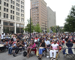 Katie Rickman | The Vindicator.A crowd gathered Saturday night to watch Kim Waters perform at the Jazz Festival downtown July 12, 2014.