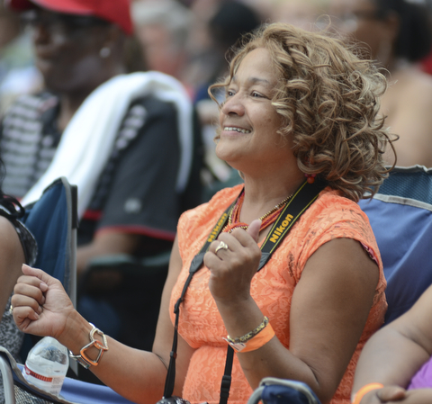 Katie Rickman | The Vindicator.Tina Glenn of Youngstown danced along during Kim Waters performance at the Jazz Festival downtown July 12, 2014.