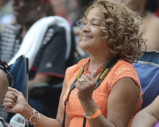 Katie Rickman | The Vindicator.Tina Glenn of Youngstown danced along during Kim Waters performance at the Jazz Festival downtown July 12, 2014.