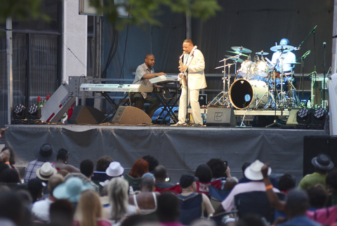 Katie Rickman | The Vindicator.A crowd gathered Saturday evening to watch Kim Waters perform during the Jazz Festival downtown.