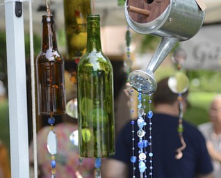 Katie Rickman | The Vindicator.Among the many items displayed and for sale at the fest Saturday were wind chimes made from bottles and watering cans. The festival continues today from 11 a.m. to 5 p.m.
