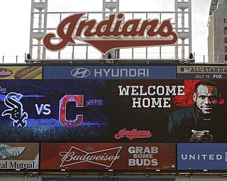 The Progressive Field scoreboard welcomes back LeBron James, during a baseball game between the Chicago White Sox and the Cleveland Indians on Friday, July 11, 2014, in Cleveland. James announced earlier in the day he would return to play for the Cleveland Cavaliers after four years in Miami. (AP Photo/Mark Duncan)
