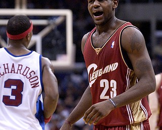 Cleveland Cavaliers' LeBron James, right, protests a call during the first half against the Los Angeles Clippers at Staples Center in Los Angeles, Wednesday, Dec. 3, 2003. James had only 4 points as the Clippers won the game 90-80. (AP Photo/Chris Pizzello)