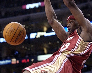 Cleveland Cavaliers' LeBron James dunks against the Los Angeles Clippers during the first half at Staples Center in Los Angeles, Wednesday, Dec. 3, 2003. (AP Photo/Chris Pizzello)