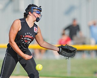 Canfield pitcher Lauren Fitzgerald throws a pitch during the top of the third inning of Monday night’s 9-10 Little League district championship game at the Field of Dreams. Canfield won 4-2.