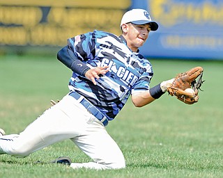Matt Kamenicky of the Ohio Glaciers makes a sliding catch in the top of the second inning for an out during a Connie Mack tourrnament game against the Astro Falcons on Tuesday at Bob Cene Park in Struthers. The Glaciers ousted the Falcons, 4-2.