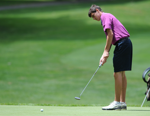 WARREN, OHIO - JULY 16, 2014: Jacob Wilson of Sharon follows through on his putt on the 6th hole Wednesday afternoon at Trumbull Country Club during the Vindy Greatest Golfer tournament. (Photo by David Dermer/Youngstown Vindicator)