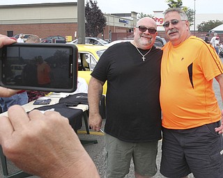 william D. Lewis The Vindicator  Fat and Furious cast member Tommy Christmas, left, poses for a snapshot with Mike Rohan of Youngstown during a car show at Quaker Steak and Lube in Boardman.