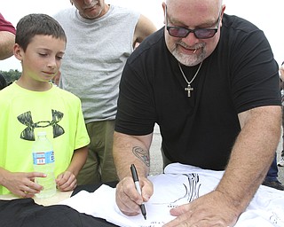william D. Lewis The Vindicator  Fat and Furious cast member TommyChristmas signs an autograph for Todd Miller, 9, of Poland during a car show at Quaker Steak and Lube in Boardman.