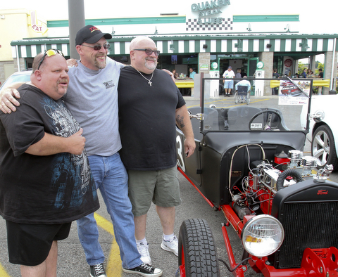 William D. Lewis The Vindicator  Fat and Furious cast members Chuck Kountz, left, and Tommy Christmas pose with fan Mike Powell of East Palestine, center, during a car show at Quaker Steak and Lube in Boardman.