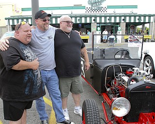 William D. Lewis The Vindicator  Fat and Furious cast members Chuck Kountz, left, and Tommy Christmas pose with fan Mike Powell of East Palestine, center, during a car show at Quaker Steak and Lube in Boardman.