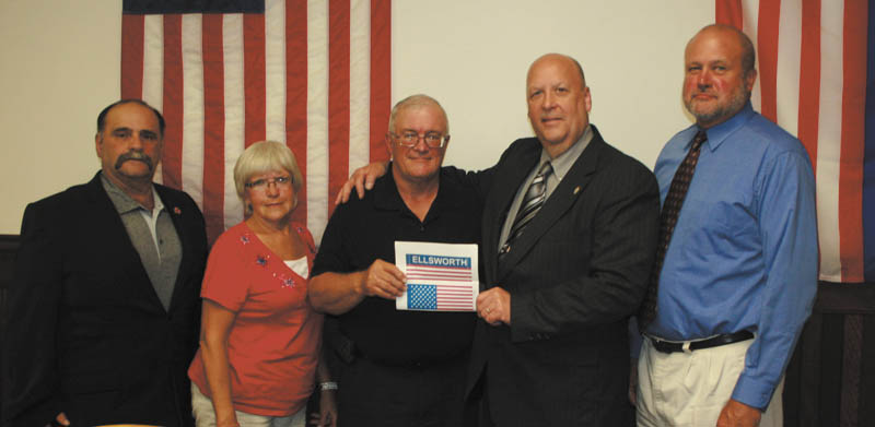 SPECIAL TO THE VINDICATOR
The Berlin-Ellsworth Ruritan Club presented the Ellsworth Township trustees with a check for $580 for four new flags that will be displayed in the township. The new flags will hang as banners. Two are American flags and two are Ellsworth flags. Denny Furman, representing the Ruritan Club, presented the check. From left to right are Artie Spellman, trustee; Karen Grittie, fiscal officer; Fred Houston, trustee; Furman; and Bob Toman, trustee.