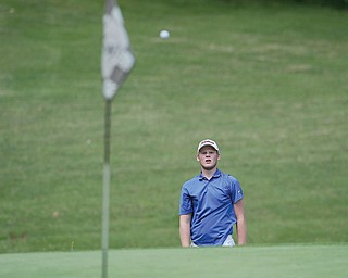 Nolan Snyder watches his shot drops near the hole on the 14th hole at Diamondback Golf Course during a recent
Greatest Golfer qualifying tournament.