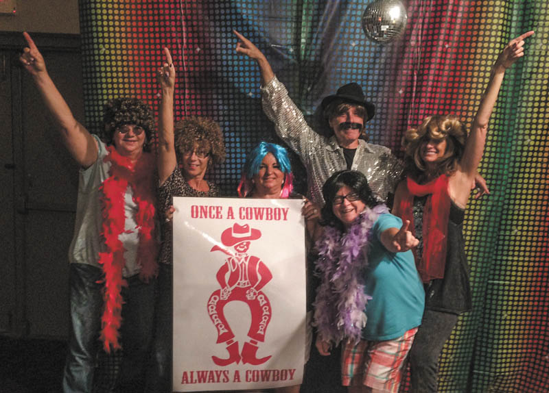 SPECIAL TO THE VINDICATOR
Chaney alumni decorate for the All ’70s Friday Night Fever Come as You Were Party, which was July 17 at Kuzman’s Lounge in Girard. From left to right are Susan Hankey Ramdin, Kim George Wagner, Georgeann Pavlinic, DJ Stephen Barba, Susan Johnson Gura and Susan Callos Ryan.