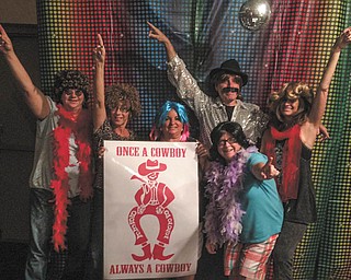 SPECIAL TO THE VINDICATOR
Chaney alumni decorate for the All ’70s Friday Night Fever Come as You Were Party, which was July 17 at Kuzman’s Lounge in Girard. From left to right are Susan Hankey Ramdin, Kim George Wagner, Georgeann Pavlinic, DJ Stephen Barba, Susan Johnson Gura and Susan Callos Ryan.