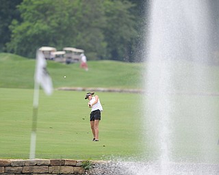 WARREN, OHIO - JULY 27, 2014: Emily Koehler follows through on her approach shot on the 9th hole Sunday afternoon at Avalon Lakes Country Club during the Vindy Greatest Golfer Tournament. (Photo by David Dermer/Youngstown Vindicator)