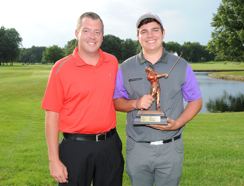 WARREN, OHIO - JULY 27, 2014: Donavan Ray poses for a picture with club pro Cory Pagliarini Sunday evening at avalon Lakes Country Club. (Photo by David Dermer/Youngstown Vindicator)