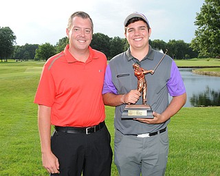 WARREN, OHIO - JULY 27, 2014: Donavan Ray poses for a picture with club pro Cory Pagliarini Sunday evening at avalon Lakes Country Club. (Photo by David Dermer/Youngstown Vindicator)