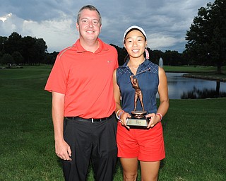 WARREN, OHIO - JULY 27, 2014: Jacinta Pikunas poses for a picture with club pro Cory Pagliarini Sunday evening at avalon Lakes Country Club. (Photo by David Dermer/Youngstown Vindicator)