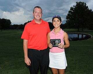 WARREN, OHIO - JULY 27, 2014: Christina Cooper poses for a picture with club pro Cory Pagliarini Sunday evening at avalon Lakes Country Club. (Photo by David Dermer/Youngstown Vindicator)