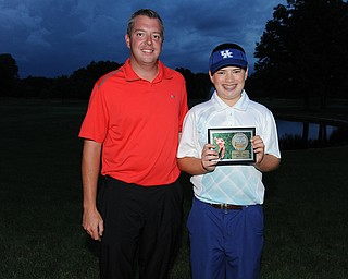 WARREN, OHIO - JULY 27, 2014: Cole Christman poses for a picture with club pro Cory Pagliarini Sunday evening at avalon Lakes Country Club. (Photo by David Dermer/Youngstown Vindicator)
