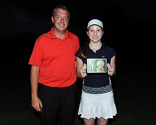 WARREN, OHIO - JULY 27, 2014: Hannah Keffler poses for a picture with club pro Cory Pagliarini Sunday evening at avalon Lakes Country Club. (Photo by David Dermer/Youngstown Vindicator)