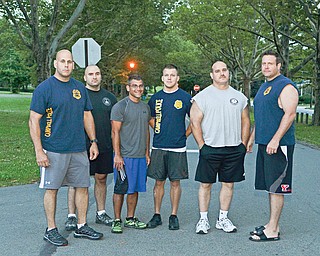Eight of the Campbell Police Department’s 13 full-time officers elected to take — and passed — a physical-fitness exam Sunday, and each will receive a $1,000 stipend for their efforts. Drew Rauzan, the department’s chief who is pictured at the far right, passed the test as well, but was not eligible for the stipend. Also pictured are, from left, Rob Vukovich, Joe Pavlansky, John Gulu, Bobby Curtis and Mitch Zupko.