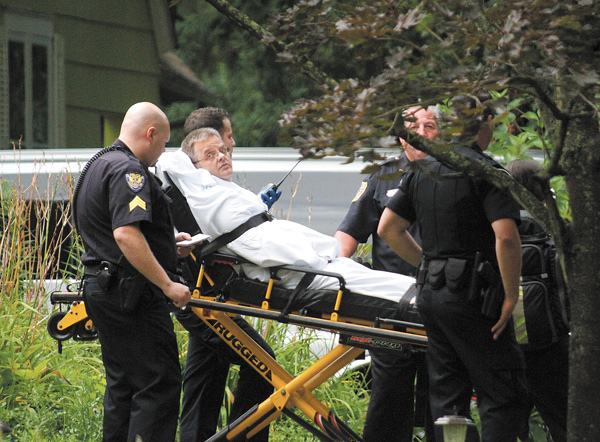Glenn Fulton, 50, of Youngstown, accused of leading police on a  high-speed chase and barricading himself in a Kiwatha Road home, is moved on a stretcher after negotiations with police.