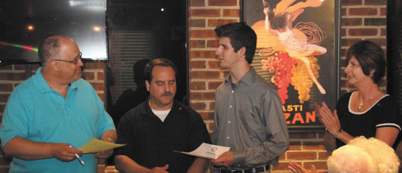 SPECIAL TO THE VINDICATOR
Struthers Rotary Club had its annual President’s Dinner recently honoring outgoing President Jim Martin at the Springfield Grille. The club celebrated its 58th year and is the only club in District 6650 to sponsor an Interact Club and Rotary Community Corps. For his service, Martin was presented with the Rotary’s Paul Harris Fellowship, and Bryan Higgins was presented with a $500 Rotary scholarship for his service. At top, Baringer presents Higgins with his scholarship as his parents look on. Below, Club Foundation Chairman Tom Baringer presents the Harris Fellowship to Martin while his wife, Terry, looks on. Kevin Freisen is the incoming president, Don Gabriele is the secretary, and Mike Evans is the treasurer. 