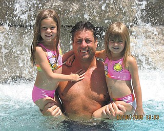 Jeff Croyle holding his two beauties while enjoying the water.