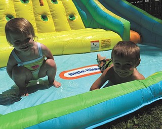 Jimmy Putko, 4, and Julia Putko, 1 and 1/2, both of Boardman were splashing and sliding around in the sun!