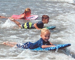 At the beach in Avalon, N.J., are Ava, Chase and Talin Massullo, "Surfin' USA". Submitted by grandparents Al and Sandy Massullo of Austintown.