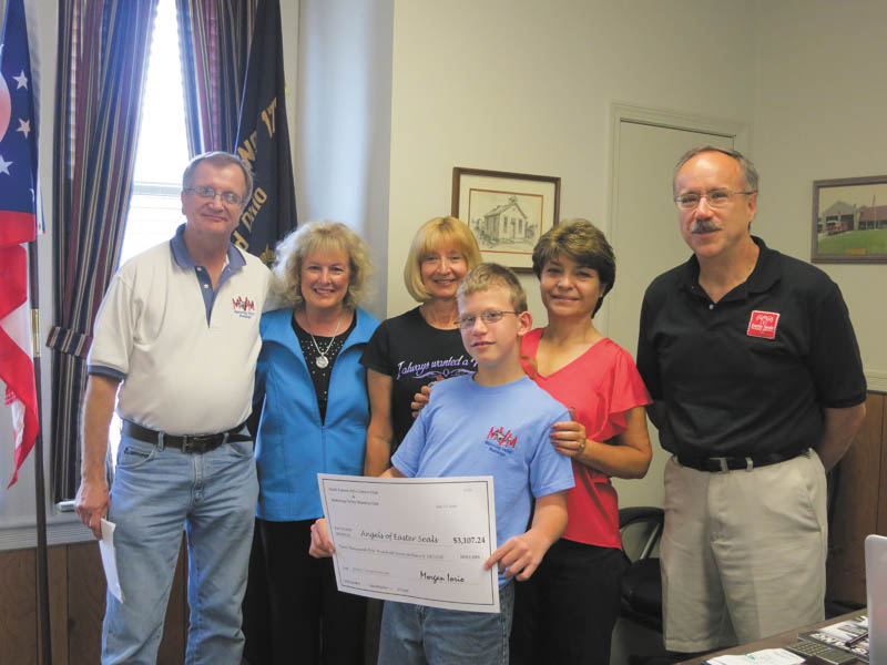 SPECIAL TO THE VINDICATOR
Mahoning County Mustangs presented a check to the Angels of Easter Seals on July 13. The club donated proceeds from its seventh annual Mustang vs. Camaro Showdown, which took place June 14 in Austintown. NorthEastern Ohio Camaro Club also took part in the event. In the front is Hunter Crites, Easter Seals Client; and in back, from left, are Bob Macabobby, vice president of the Mahoning Valley Mustangs and chairman of the showdown; Lynn Sahli, president of the Angels; Nancy Evans, president of the Mahoning Valley Mustangs; Carol O’Neill, Angels; and Tim Nelson, president and CEO of Easter Seals.