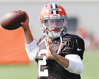 Cleveland Browns quarterback Johnny Manziel passes during practice at the team’s training camp Monday in Berea.
