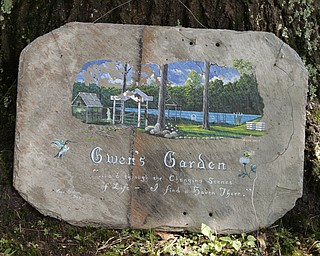 ROBERT K. YOSAY | THE VINDICATOR.. The Garden is named after Father Dave's mother..Our Lady of the Lakes Parish-- has an oasis for solitude or just reflection or just enjoying the flowers as the Rev. David W. Merweiler is pastor and gardener..... -30-