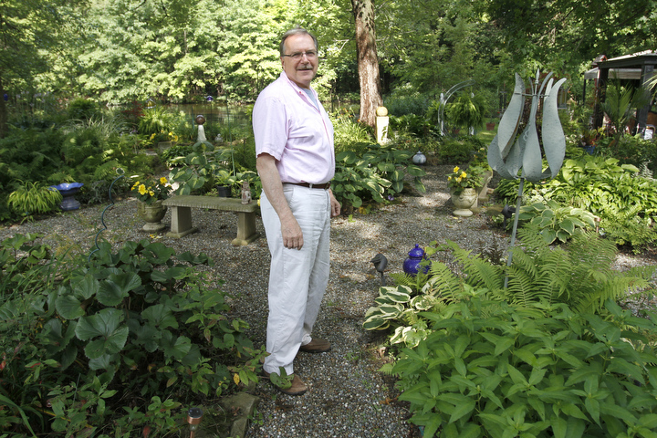        ROBERT K. YOSAY  | THE VINDICATOR.. Our Lady of the Lakes Parish-- has an oasis for solitude or just reflection or just enjoying the flowers as the Rev. David W. Merweiler is pastor and gardener.....  -30-