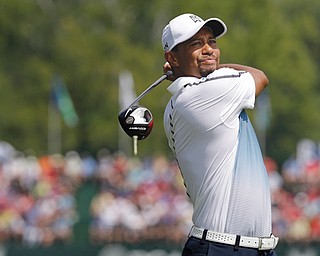 A few days after withdrawing from Bridgestone in Akron with back pain, Tiger Woods was in action Wednesday at a practice round for the PGA Championship at the Valhalla Golf Club in Louisville, Ky. Play begins today.