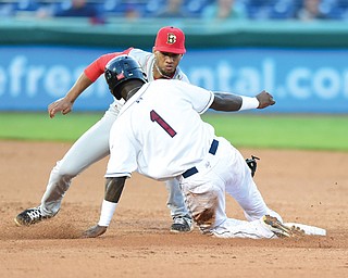 Mahoning Valley baserunner D’Vone McClure is tagged out by Brooklyn shortstop Amed Rosario in the fifth inning of their New York-Penn League game Thursday at Eastwood Field in Niles. The Scrappers were shut out by the Cyclones, 4-0.