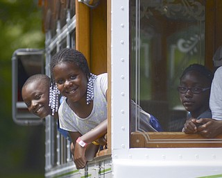 Katie Rickman | The Vindicator.Mykhi (OKAY) Moore, 8, Aija (OKAY) Clarett, 11,L-R and Kimora Jones, 8, all of Youngstown....The friends all from Youngstown ride the Cohasset Trolley from the Family Camp and around the park August 9, 2014.
