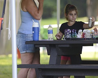 Katie Rickman | The Vindicator.Kim Carolyne of North Lima stands next to her granddaughter Corena Carolyne, 7, as she works on a craft at the Family Camp at Mill Creek MetroPark August 9, 2014.